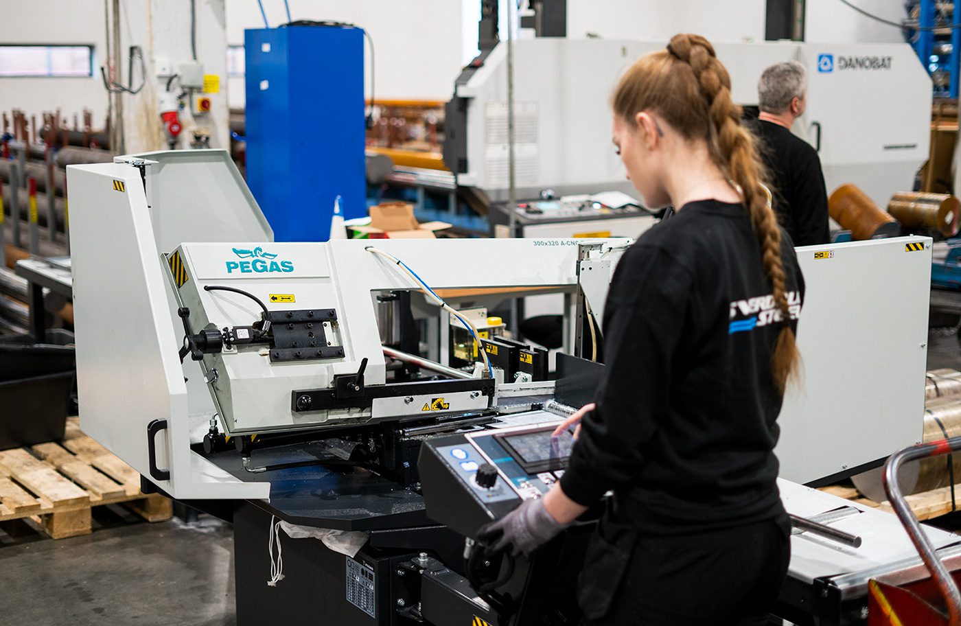 Anna operating the Pegas 300 cutting machine