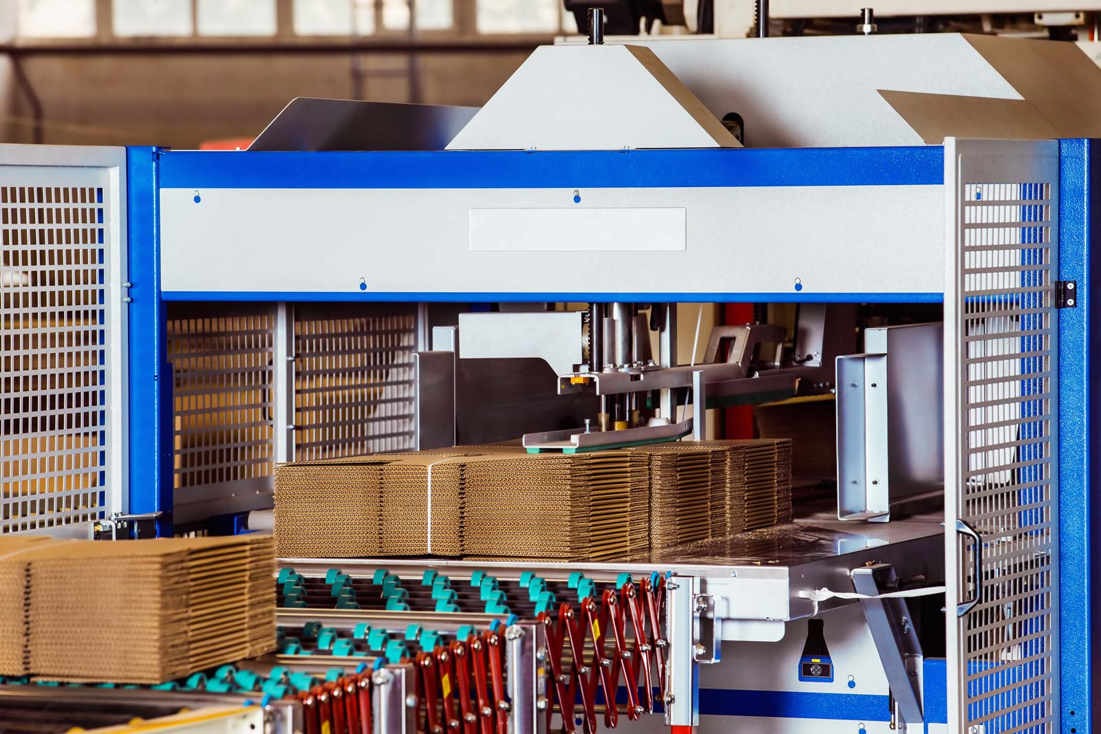 Cardboard being processed in an industrial machine