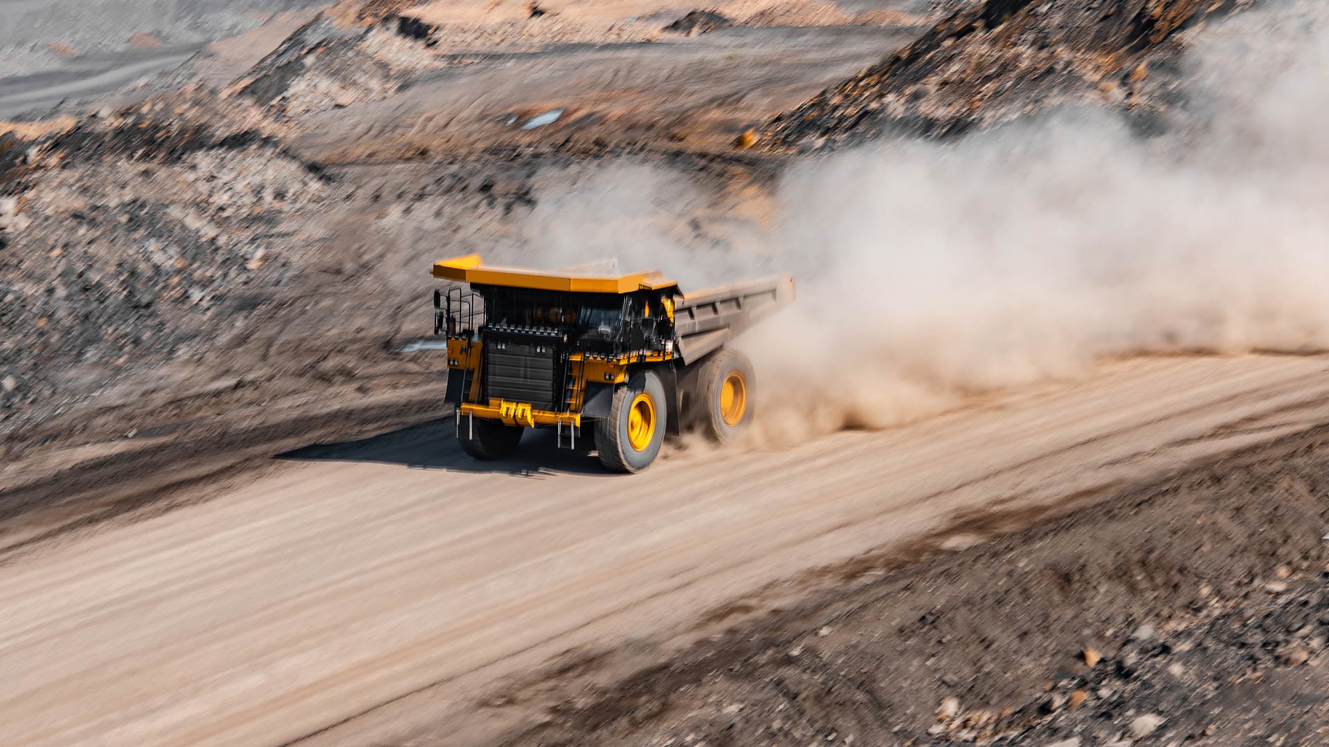 A large mining truck driving on the road